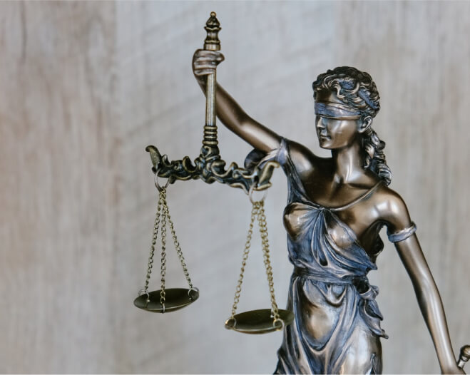Lady Justice holding the Scales of Justice.